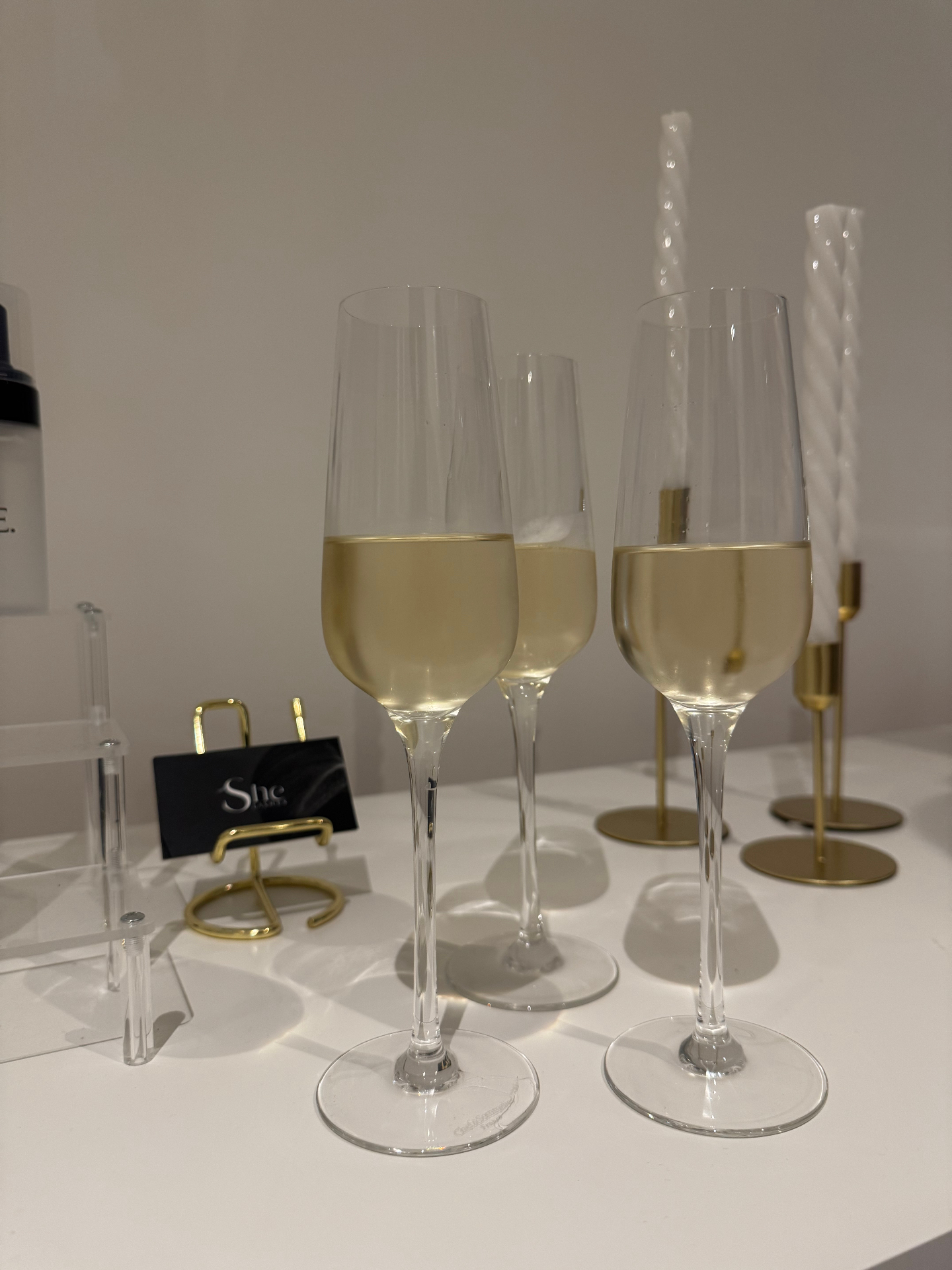 Champagne glasses at SHE. Lashes space